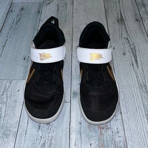Nike basketball shoes- boys size 2. Black/white/gold. Never worn outside!